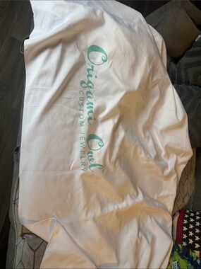 Origami Owl White round tablecloth with Teal Logo